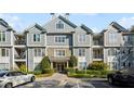 Well-maintained condo building exterior with balconies and landscaped grounds at 4100 Paces Se Walk # 3205, Atlanta, GA 30339