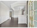 Welcoming entryway featuring hardwood floors, elegant trim, and a decorative glass front door at 1566 Wilson Manor Cir, Lawrenceville, GA 30045