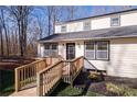 Charming two-story home with a modern entrance and a well-manicured lawn at 172 White Rose Ln, Temple, GA 30179