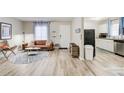 Open living space with hardwood floors connected to a modern kitchen at 1351 Eason Nw St, Atlanta, GA 30314