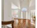 Bright foyer showcasing hardwood floors, high ceilings, and an arched entryway with natural light at 1462 Valley Glen Way, Dunwoody, GA 30338