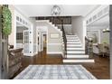 Bright foyer with hardwood floors, staircase with iron spindles, and classic trim at 65 Gatewood Dr, Marietta, GA 30068