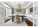Stylish office with wainscoting, bay window, hardwood floors, and a modern chandelier at 65 Gatewood Dr, Marietta, GA 30068