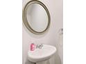 Modern half bathroom featuring a stylish sink and neutral decor at 5652 Plain Field Ln, Lilburn, GA 30047