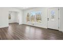 Bright living room featuring wood floors, fresh paint, and lots of natural light at 1189 Kathryn Cir, Forest Park, GA 30297