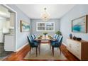 Elegant dining room with hardwood floors, a chandelier, and seating for six guests at 2126 Chevy Chase Ln, Decatur, GA 30032