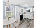 Cozy kitchen with white cabinets, granite countertops, stainless steel appliances, and a breakfast nook at 2126 Chevy Chase Ln, Decatur, GA 30032