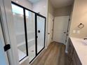 Elegant bathroom featuring a walk-in shower with glass enclosure and modern fixtures at 156 Easton Park Blvd, Dallas, GA 30157
