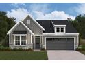 Charming home with gray siding, stone accents, a two-car garage, and a well-manicured lawn at 156 Easton Park Blvd, Dallas, GA 30157