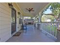Inviting front porch with a swing, rocking chair, and ceiling fan at 265 Haas Se Ave, Atlanta, GA 30316