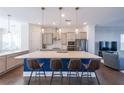 Kitchen with center island, stainless appliances, pendant lighting, and breakfast bar seating at 419 Hargrove Ln, Decatur, GA 30030