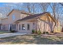 Attractive home showcasing brick and vinyl siding, complemented by mature trees at 2593 Fieldstone View Se Ln, Conyers, GA 30013