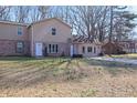 Charming home featuring a brick facade, vinyl siding, and a spacious front yard at 2593 Fieldstone View Se Ln, Conyers, GA 30013