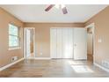 Comfortable bedroom with ample closet space, a ceiling fan, and plenty of natural light at 3867 Cherie Glen Rd, Snellville, GA 30039