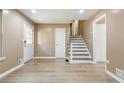 Bright living room with beautiful wood-look flooring and fresh neutral paint at 3867 Cherie Glen Rd, Snellville, GA 30039