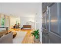 Inviting entryway with a striking door and a view of the living and dining areas at 1445 Monroe Ne Dr # A12, Atlanta, GA 30324