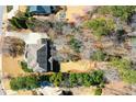 Aerial shot of home and backyard featuring a lush green space, patio, and a well-maintained yard at 3150 Shumard Way, Marietta, GA 30064