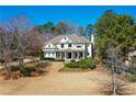 Elegant exterior showcases well-maintained landscaping and a classic design, set among mature trees at 3150 Shumard Way, Marietta, GA 30064