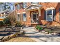 Charming front entrance with brick walkway and well-kept landscaping at 656 Gunby Se Rd, Marietta, GA 30067