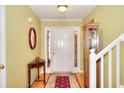 Inviting foyer showcasing hardwood floors, a stylish table and a decorative mirror at 1500 Elena Dr, Mcdonough, GA 30253