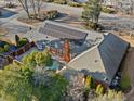 Aerial view of a backyard with a private pool, solar panels, and a brick home, showcasing outdoor amenities at 290 Connemara Ne Dr, Marietta, GA 30067
