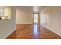 Sun-filled living room boasts gleaming hardwood floors and neutral paint at 3301 Henderson Mill Rd, Atlanta, GA 30341