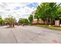 Well-maintained grounds at Sky Apartments feature lush trees and convenient gated entrances for a secure and serene living environment at 898 Oak Sw St # 3109, Atlanta, GA 30310