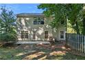 Spacious backyard with patio, grassy area, and mature trees offering shade at 3331 Freedom Nw Lndg, Kennesaw, GA 30144