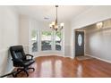 Bright living room featuring hardwood floors, a bay window, and neutral paint at 3331 Freedom Nw Lndg, Kennesaw, GA 30144