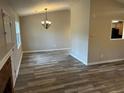 Open-concept living room with ceiling fan and wood flooring at 4227 Sheppard Xing Way, Stone Mountain, GA 30083