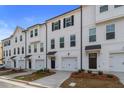 New townhome exterior with white siding, garage, and a 'sold' sign indicating high demand at 3151 Washburn Sw St, Atlanta, GA 30354