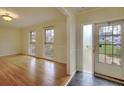 Bright living room boasts hardwood floors, neutral paint, and abundant natural light through the windows at 4696 Dunover Cir, Dunwoody, GA 30360