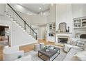 Inviting living room featuring a fireplace, hardwood floors, and staircase access at 1307 Calderwood Se Ct, Smyrna, GA 30080