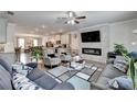 Stylish living room featuring modern fireplace, open layout, and comfortable seating area at 2137 Post Grove Rd, Snellville, GA 30078