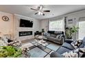 Bright living room featuring a fireplace, neutral tones, and comfortable furnishings at 2137 Post Grove Rd, Snellville, GA 30078