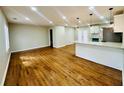Spacious open-concept living room featuring recessed lighting and refinished hardwood floors at 2745 Marco Nw Dr, Atlanta, GA 30318
