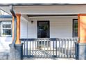 Close up of the porch with stylish railing and stone base pillar at 1108 Sw Welch Sw St, Atlanta, GA 30310