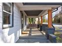 Inviting front porch features wood pillars, a cozy bench, and offers a relaxing outdoor space at 1108 Sw Welch Sw St, Atlanta, GA 30310