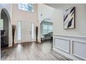 Inviting foyer with modern wood-look floors, archways, and bright natural light at 117 Kiara Ln, Stockbridge, GA 30281