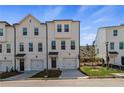 A charming townhouse with a well-manicured lawn, covered entryway, and attached single-car garage at 3200 Bateman Dr, Atlanta, GA 30354