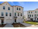 Desirable townhome features private garages, covered entryways and professionally landscaped front yards at 3200 Bateman Dr, Atlanta, GA 30354