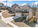 Beautiful two-story home with a brick facade, two-car garage and well-maintained landscaping at 431 Crestmont Ln, Canton, GA 30114