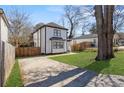 Exterior view of the house with a driveway and lush green lawn at 1088 Hubbard Sw St, Atlanta, GA 30310