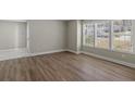 Well-lit living room featuring hardwood floors and bright, sunny windows at 1088 Hubbard Sw St, Atlanta, GA 30310