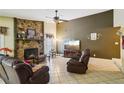 Comfortable living room with tile flooring and a stone fireplace, perfect for gatherings at 1249 Herrington Rd, Lawrenceville, GA 30044