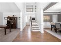 Welcoming foyer with hardwood floors, staircase, and open layout at 6117 Summerstone Ln, Douglasville, GA 30135