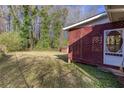 View of a spacious backyard with a latticed porch and a storage shed at 6582 Malvin Dr, Mableton, GA 30168