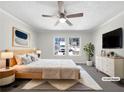 Comfortable bedroom with a queen bed, natural light, and modern decor at 8072 Crystal Ln, Douglasville, GA 30134