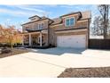 Beautiful brick home with a spacious driveway and attached two-car garage, offering both style and functionality at 14 Long Island Pl., Atlanta, GA 30328