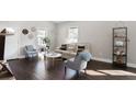 Bright living room featuring hardwood floors, neutral paint, and stylish decor for comfortable living at 444 W Lake Nw Ave, Atlanta, GA 30318